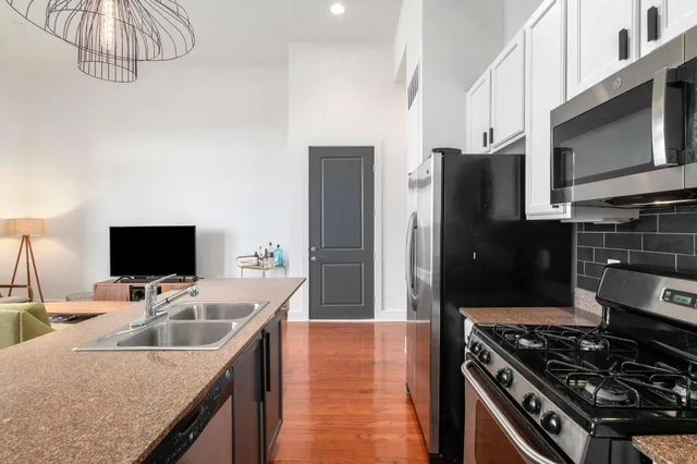 a kitchen with a stove and a microwave