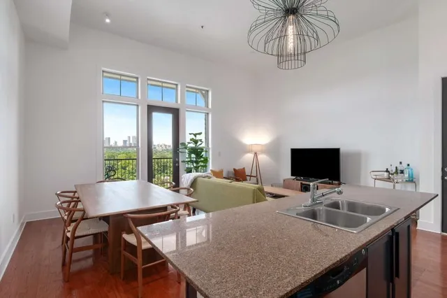 a view of a dining room with furniture window and outside view