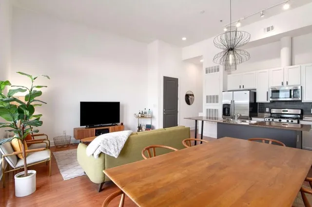 a bedroom with furniture and a flat screen tv