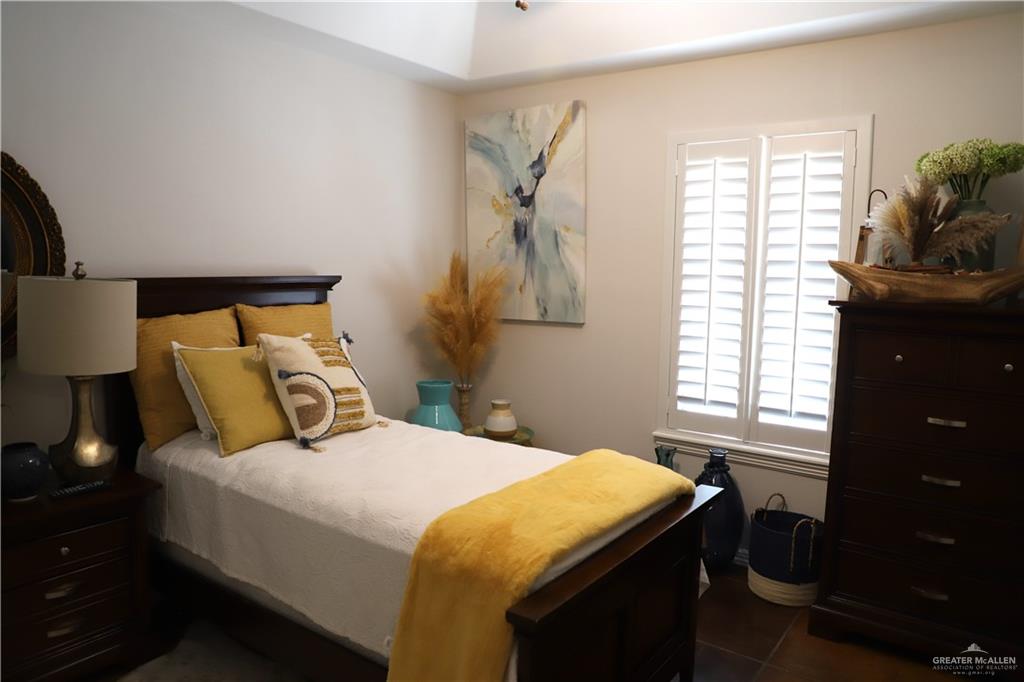 12431 Ware Road Edinburg, TX 78541 - Photo 15 of 37 a bedroom with a bed and a window