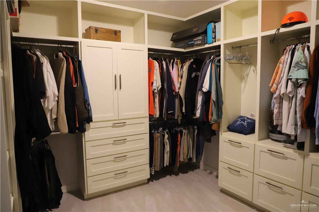 12431 Ware Road Edinburg, TX 78541 - Photo 20 of 37 a view of walk in closet with clothes and shoes