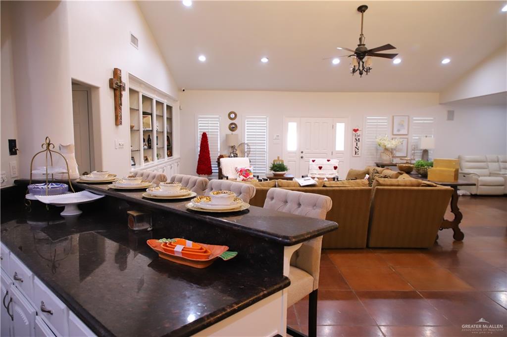 12431 Ware Road Edinburg, TX 78541 - Photo 23 of 37 a kitchen with a table and chairs in it