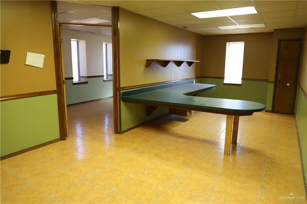 12431 Ware Road Edinburg, TX 78541 - Photo 26 of 37 a room with a table and a refrigerator