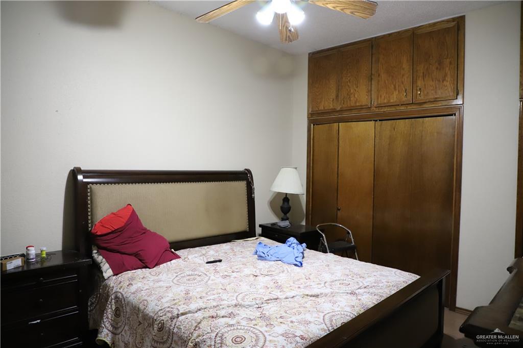 12431 Ware Road Edinburg, TX 78541 - Photo 37 of 37 a bedroom with a bed and a dresser