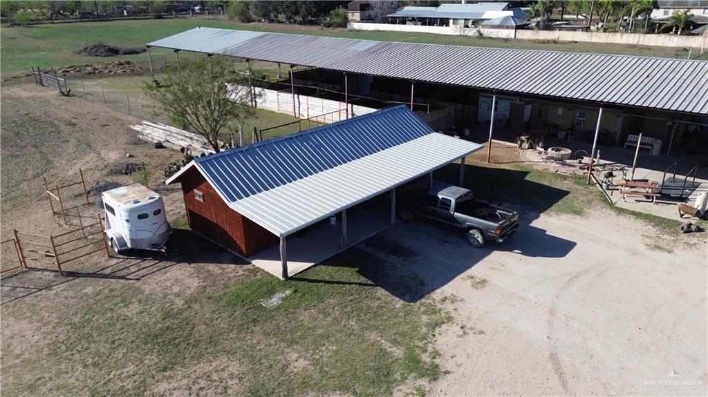 12431 Ware Road Edinburg, TX 78541 - Photo 6 of 37 a view of a patio with table and chairs near an umbrella