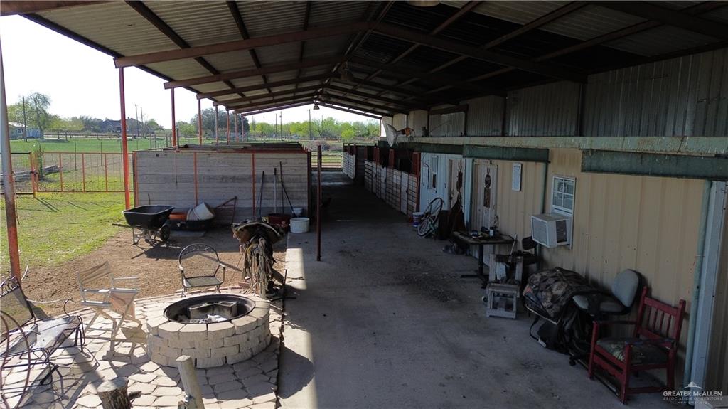 12431 Ware Road Edinburg, TX 78541 - Photo 8 of 37 a room with water heater and a wooden door