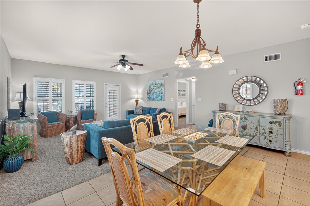 14427 Compass Street, Unit B12 Corpus Christi, TX 78418 - Photo 11 of 40 Lovely dining table and chairs is ready to be enjo