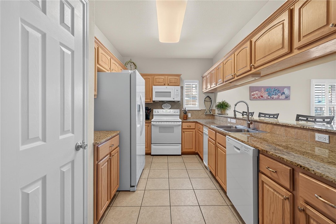 14427 Compass Street, Unit B12 Corpus Christi, TX 78418 - Photo 6 of 40 Kitchen appliances have been recently replaced.