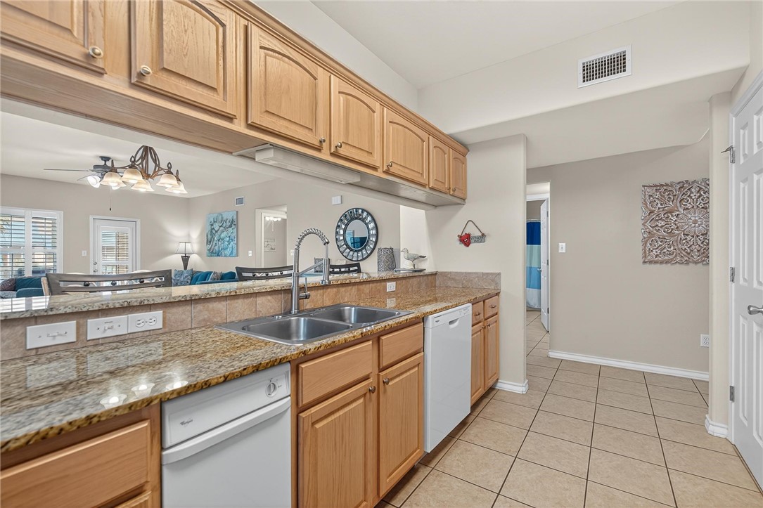 14427 Compass Street, Unit B12 Corpus Christi, TX 78418 - Photo 7 of 40 Plenty of storage in this spacious kitchen.