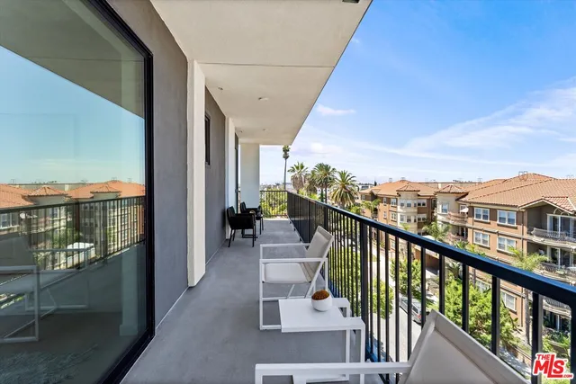 a view of a balcony with city view