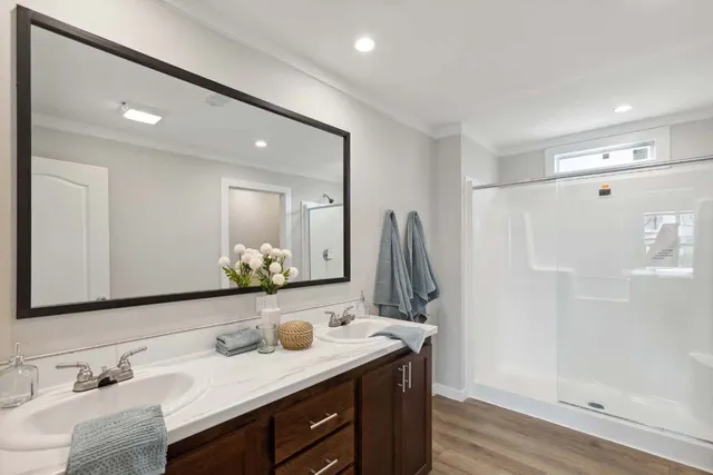 a kitchen with granite countertop stainless steel appliances a stove a sink a microwave a dining table and chairs