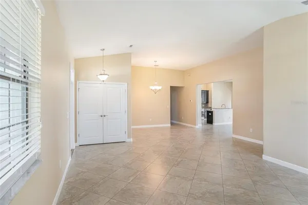 a view of a hallway with a bathroom and a sink