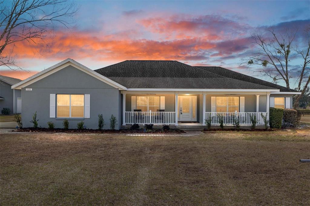 1120 East Highway 316 Citra, FL 32113 - Photo 1 of 61 a view of a house with a yard