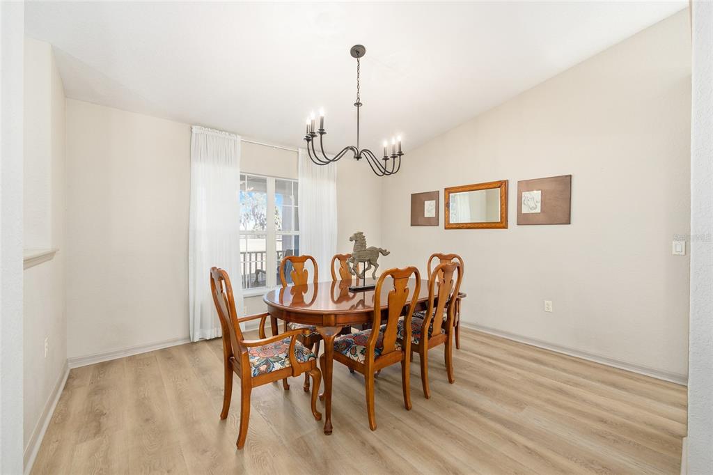 1120 East Highway 316 Citra, FL 32113 - Photo 12 of 61 a view of a dining room with furniture window and wooden floor