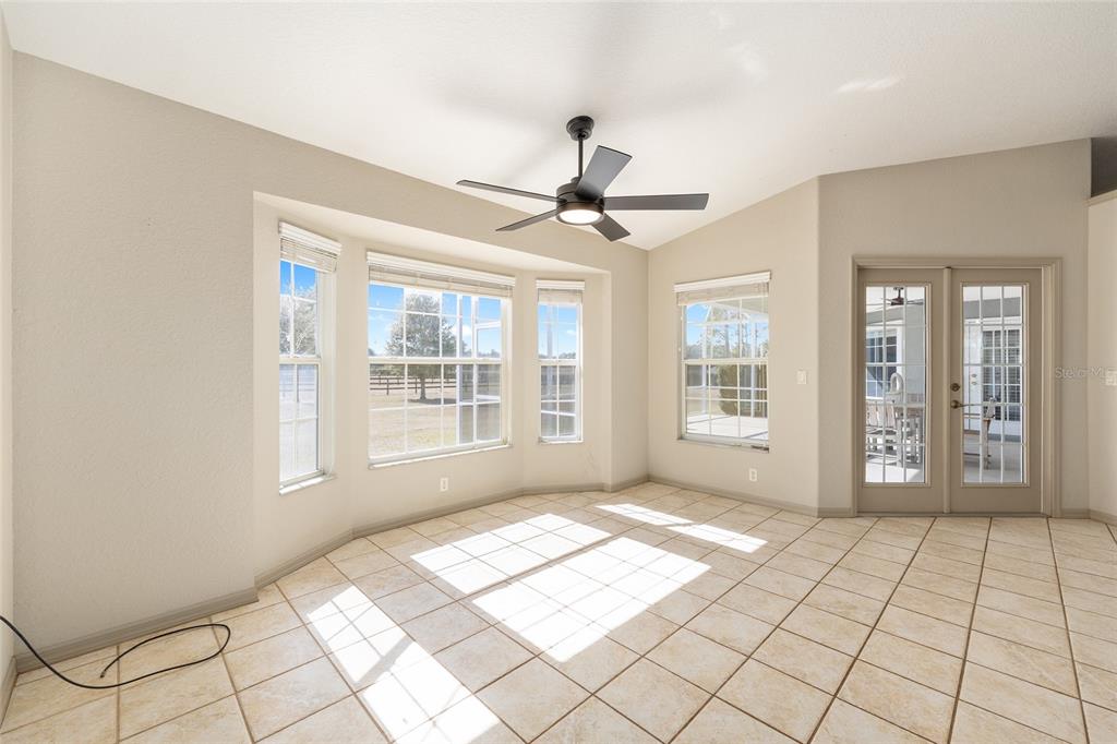 1120 East Highway 316 Citra, FL 32113 - Photo 15 of 61 a view of an empty room with window and chandelier fan