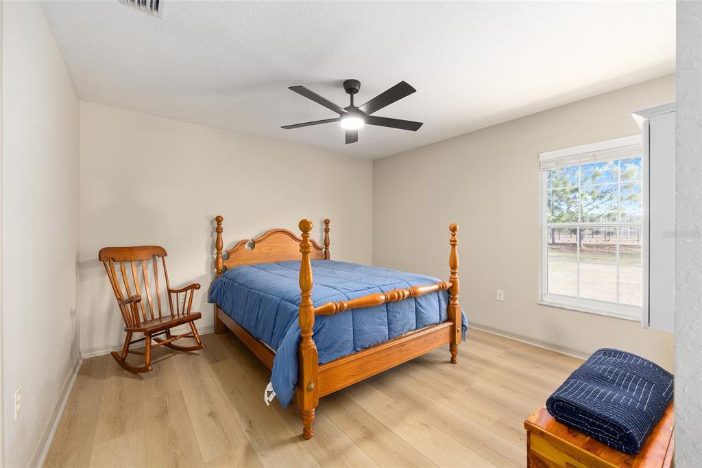 1120 East Highway 316 Citra, FL 32113 - Photo 17 of 61 a bedroom with a bed and a window