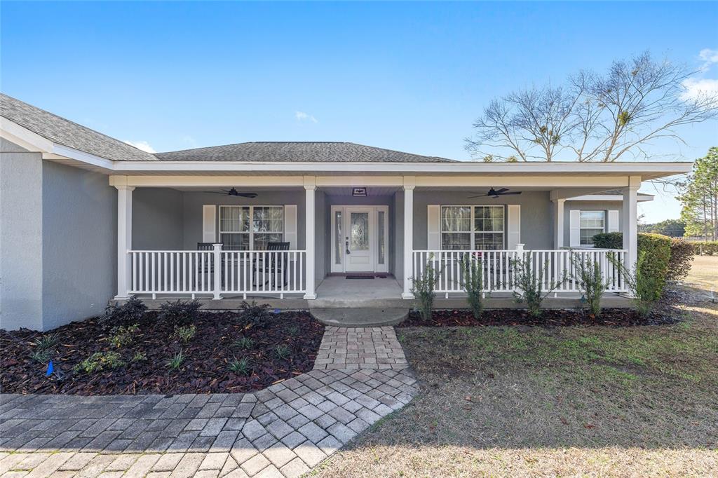 1120 East Highway 316 Citra, FL 32113 - Photo 2 of 61 front view of a house with a yard