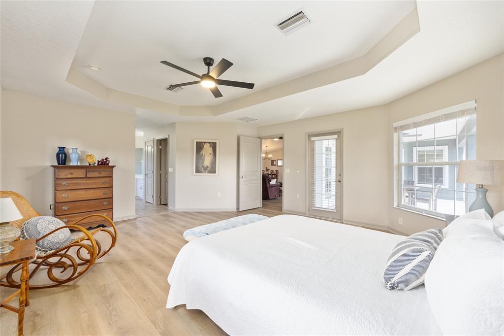 1120 East Highway 316 Citra, FL 32113 - Photo 24 of 61 a spacious bedroom with a bed and ceiling fan