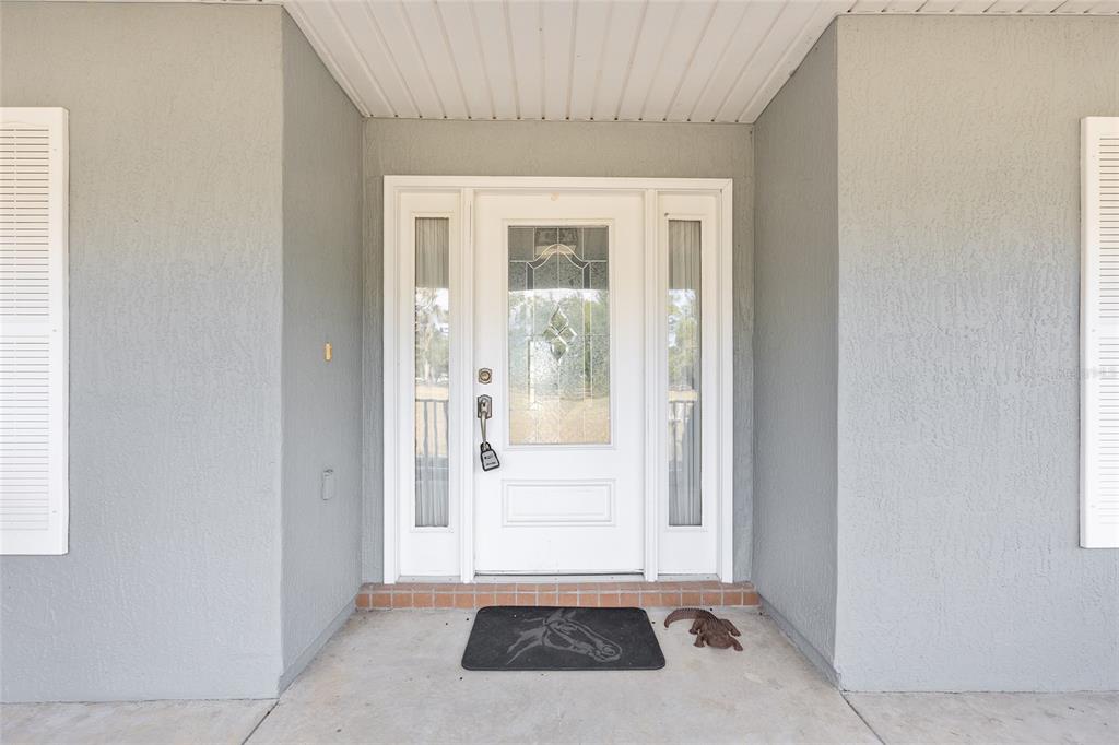 1120 East Highway 316 Citra, FL 32113 - Photo 3 of 61 a view of a hallway with a glass door and windows