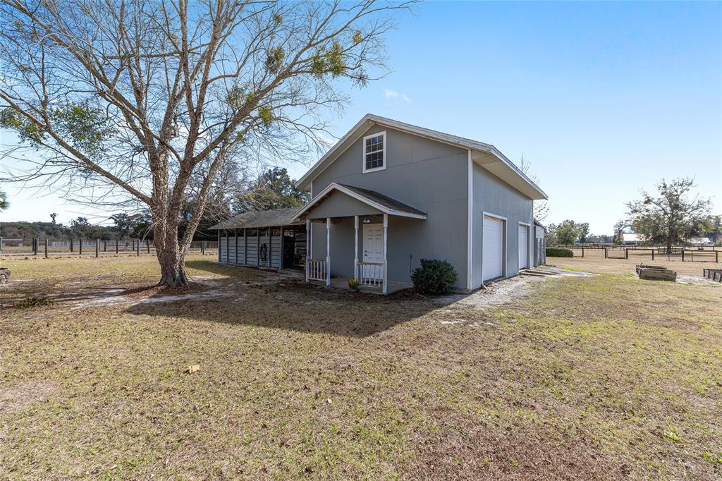 1120 East Highway 316 Citra, FL 32113 - Photo 38 of 61 a front view of a house with a yard
