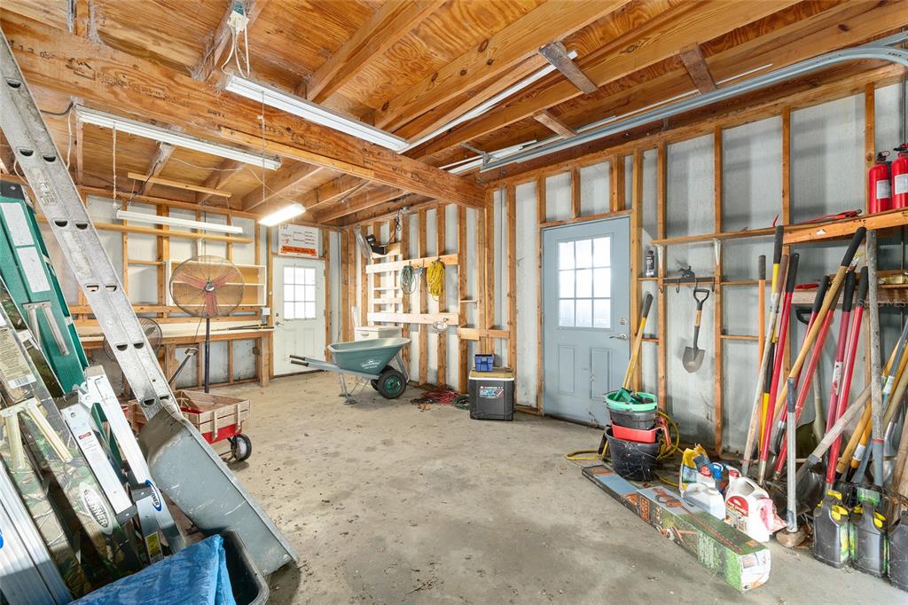 1120 East Highway 316 Citra, FL 32113 - Photo 44 of 61 a living room with lots of furniture and a chandelier