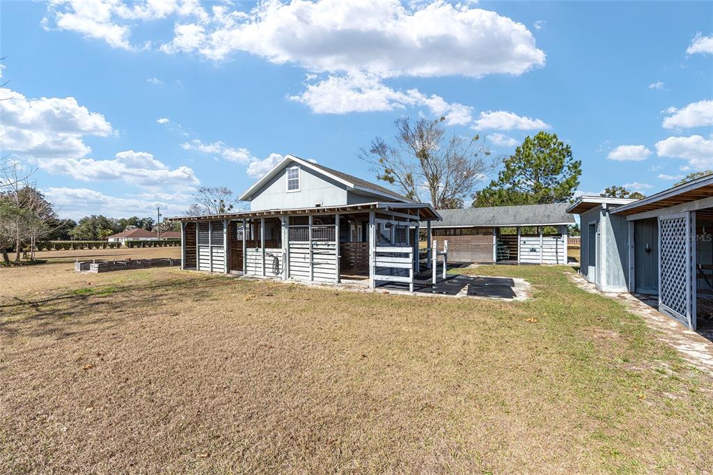 1120 East Highway 316 Citra, FL 32113 - Photo 48 of 61 a front view of a house with a yard and garage