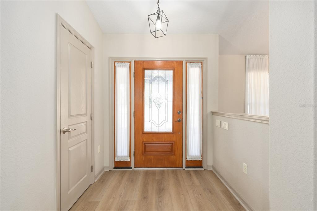 1120 East Highway 316 Citra, FL 32113 - Photo 5 of 61 a view of a room with wooden floor and windows