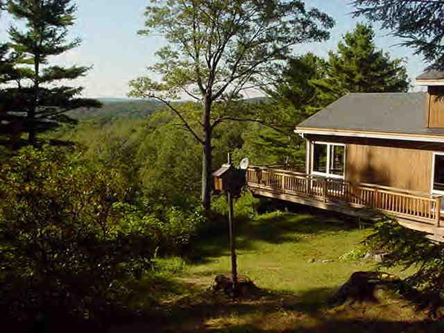 239 Abbott Hill Road Chester, MA 01011 - Photo 2 of 8 a view of a house with pool