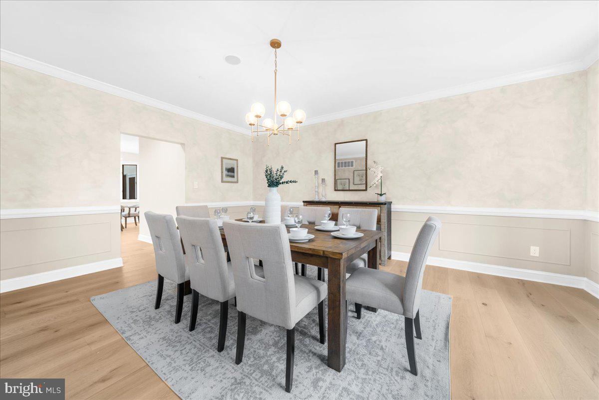 4205 Goshen Road Newtown Square, PA 19073 - Photo 14 of 104 a view of a dining room with furniture and wooden floor