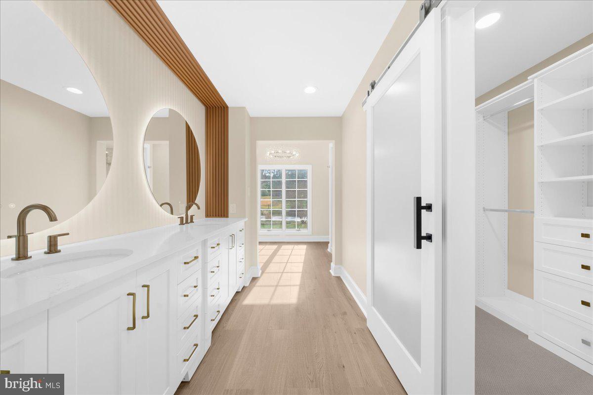 4205 Goshen Road Newtown Square, PA 19073 - Photo 45 of 104 a spacious bathroom with a double vanity sink and a large mirror