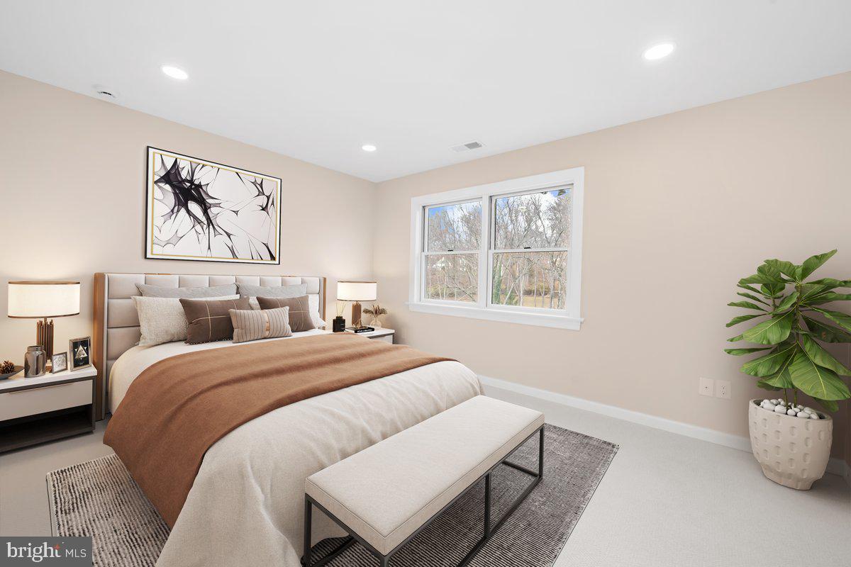 4205 Goshen Road Newtown Square, PA 19073 - Photo 54 of 104 a bed room with a bed and a potted plant