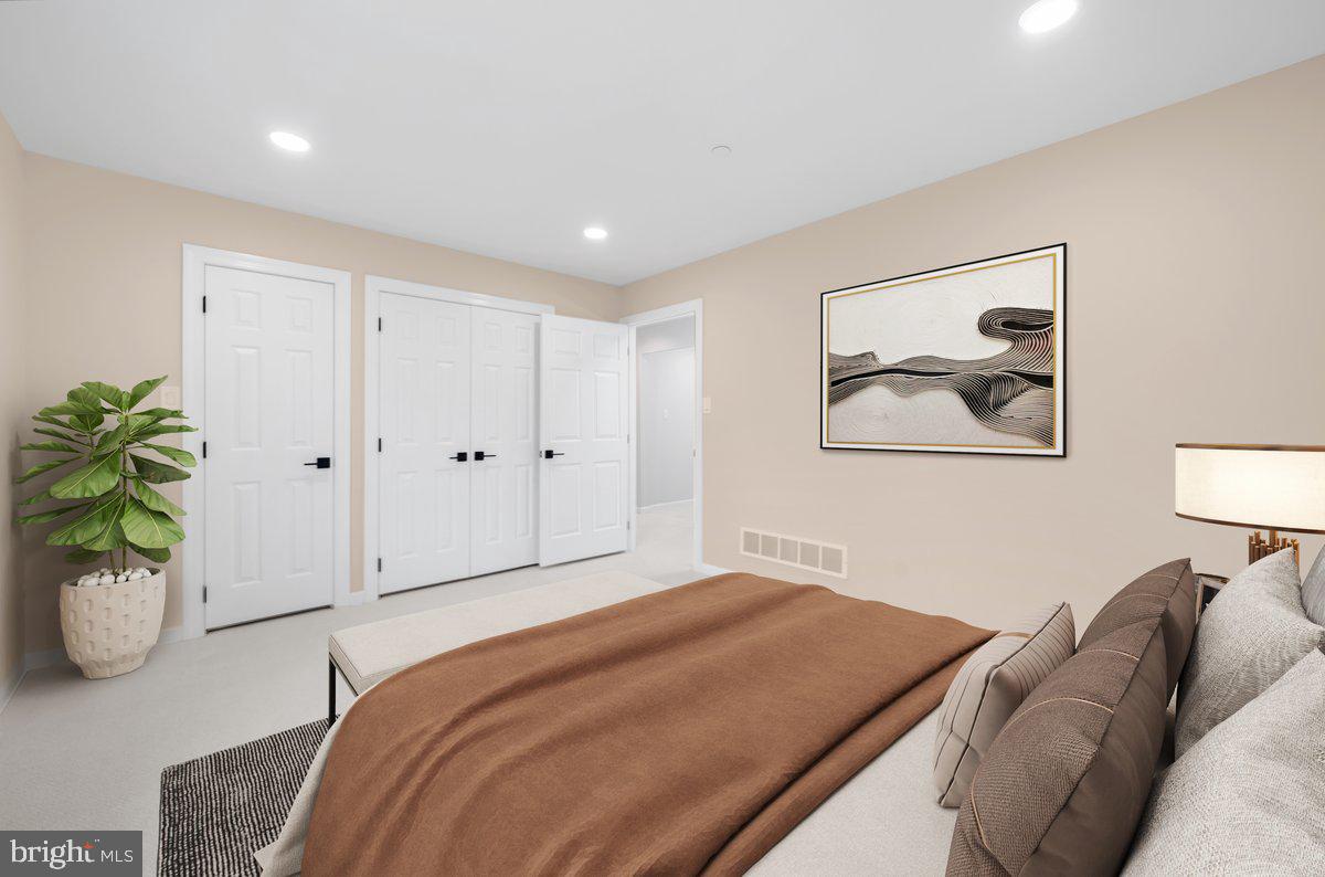 4205 Goshen Road Newtown Square, PA 19073 - Photo 56 of 104 a bedroom with a bed and a potted plant