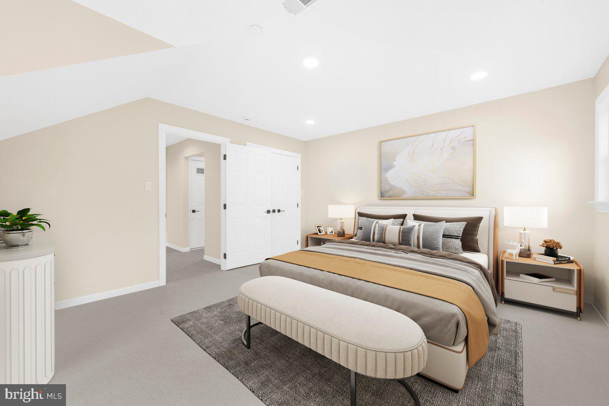 4205 Goshen Road Newtown Square, PA 19073 - Photo 65 of 104 a spacious bedroom with a bed and a couch