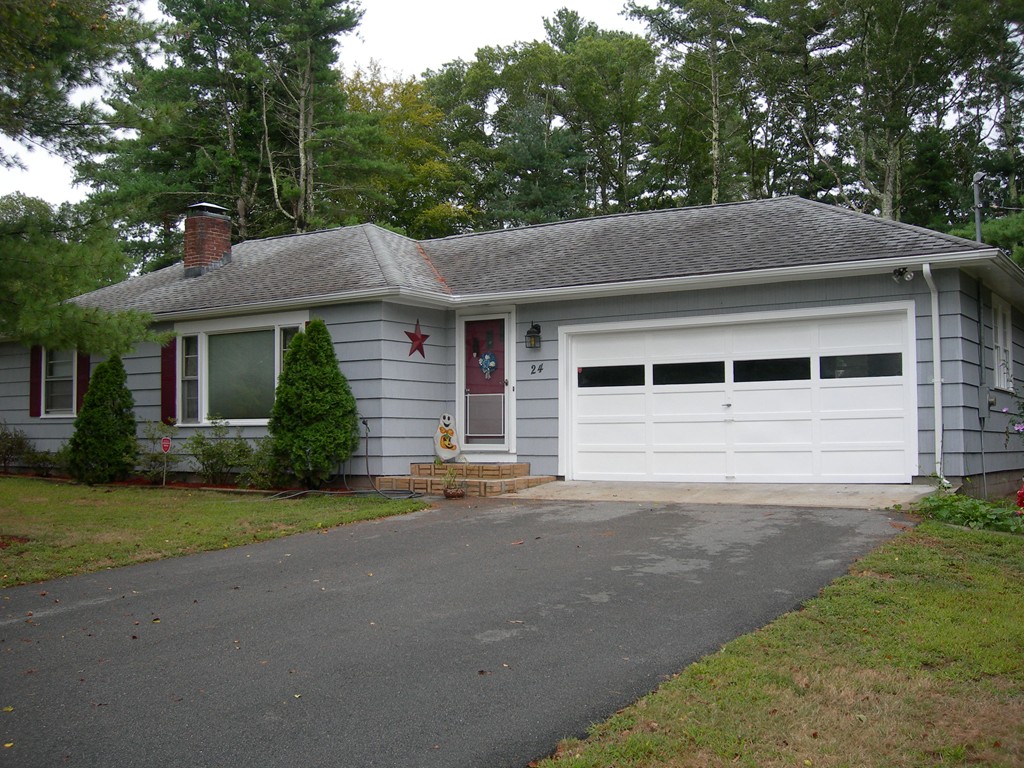 24 Morton Road Freetown, MA 02717 - Photo 1 of 12 a front view of a house with a yard and garage