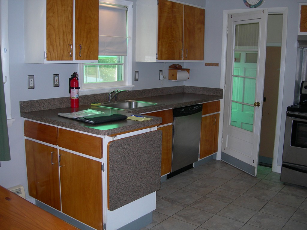24 Morton Road Freetown, MA 02717 - Photo 5 of 12 a kitchen with stainless steel appliances granite countertop a sink stove and cabinets