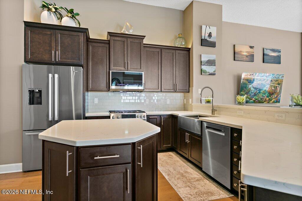 841 Ifield Road St. Augustine, FL 32095 - Photo 13 of 69 a kitchen with stainless steel appliances a sink cabinets and refrigerator