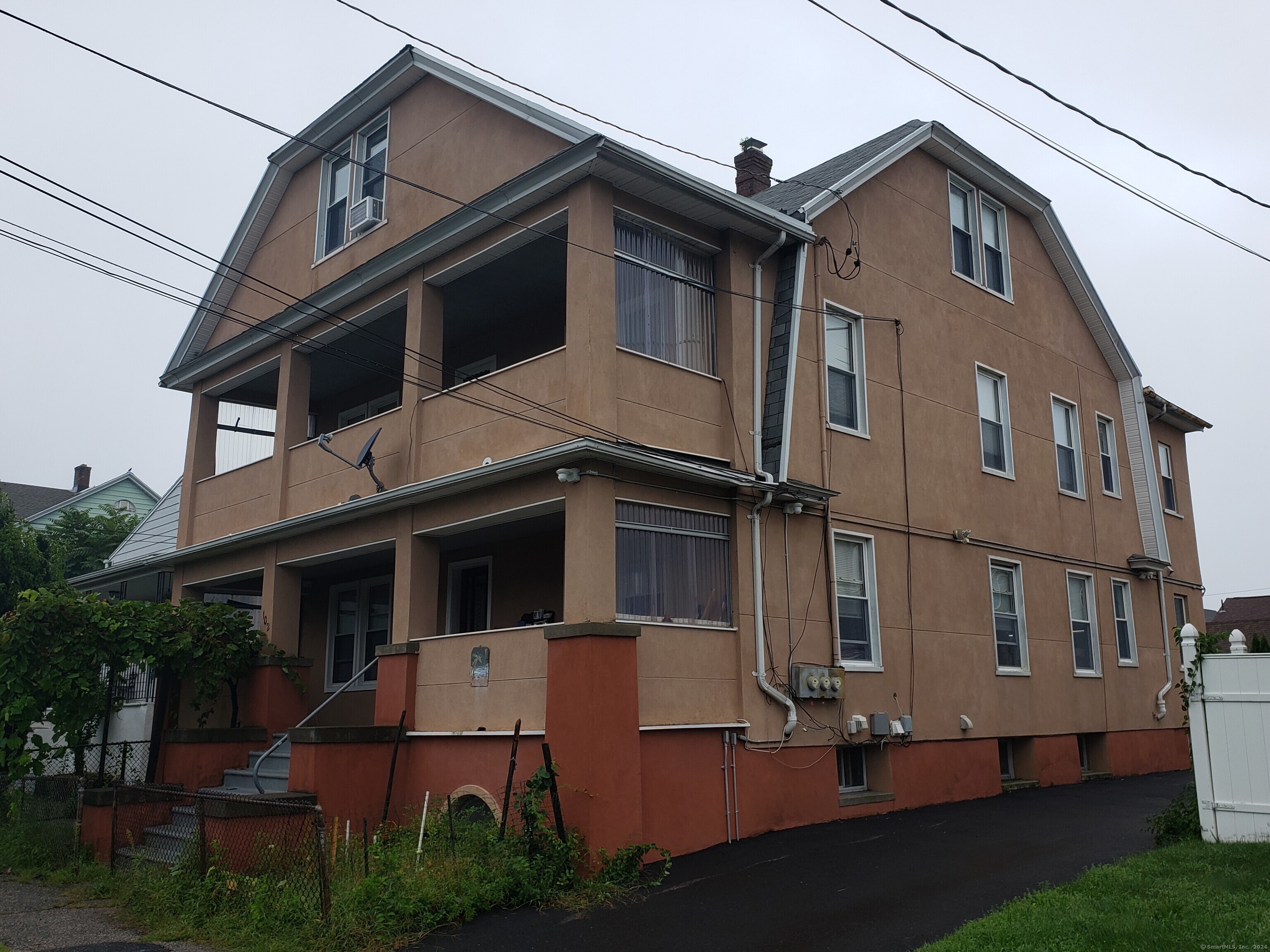 102 Fairfield Avenue Waterbury, CT 06708 - Photo 1 of 1 a view of a white building among the street