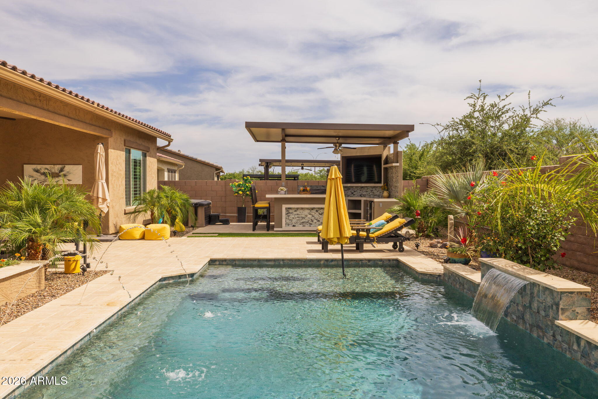 a view of a house with backyard porch and furniture