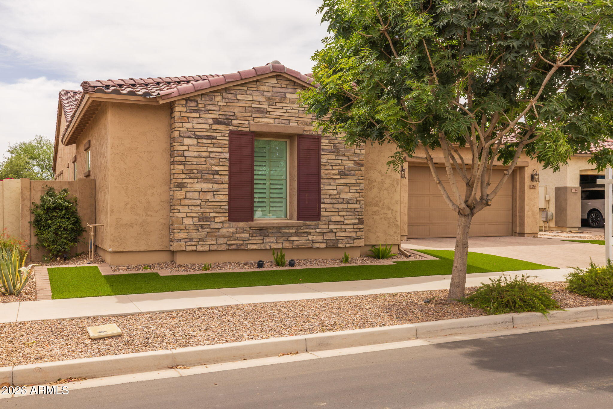 5250 South Wesley Mesa, AZ 85212 - Photo 11 of 89 a front view of a house with a yard and garage