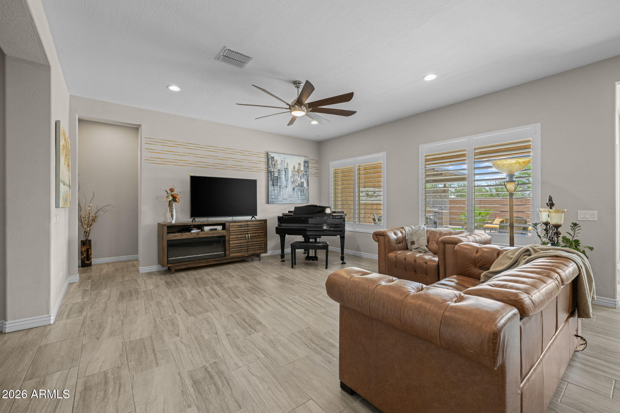 5250 South Wesley Mesa, AZ 85212 - Photo 13 of 89 a living room with furniture flat screen tv and a large window