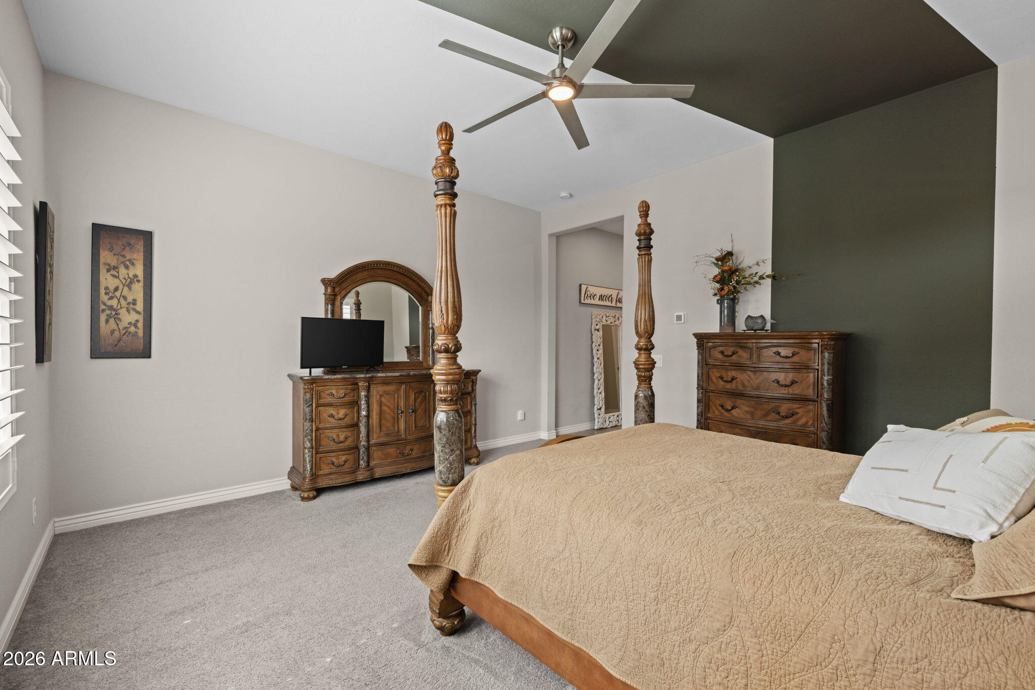 5250 South Wesley Mesa, AZ 85212 - Photo 23 of 89 a bedroom with a bed and dresser with mirror