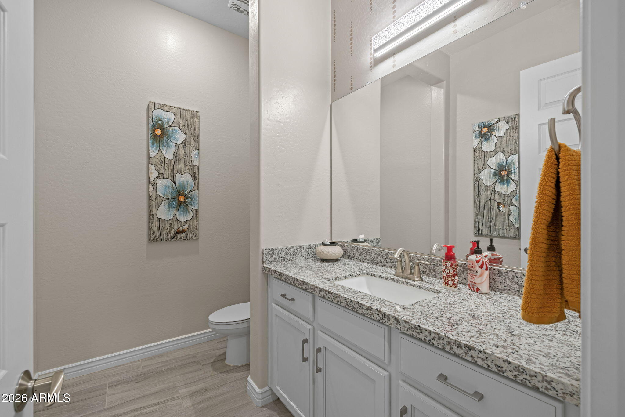 5250 South Wesley Mesa, AZ 85212 - Photo 35 of 89 a bathroom with a granite countertop sink a toilet and a mirror