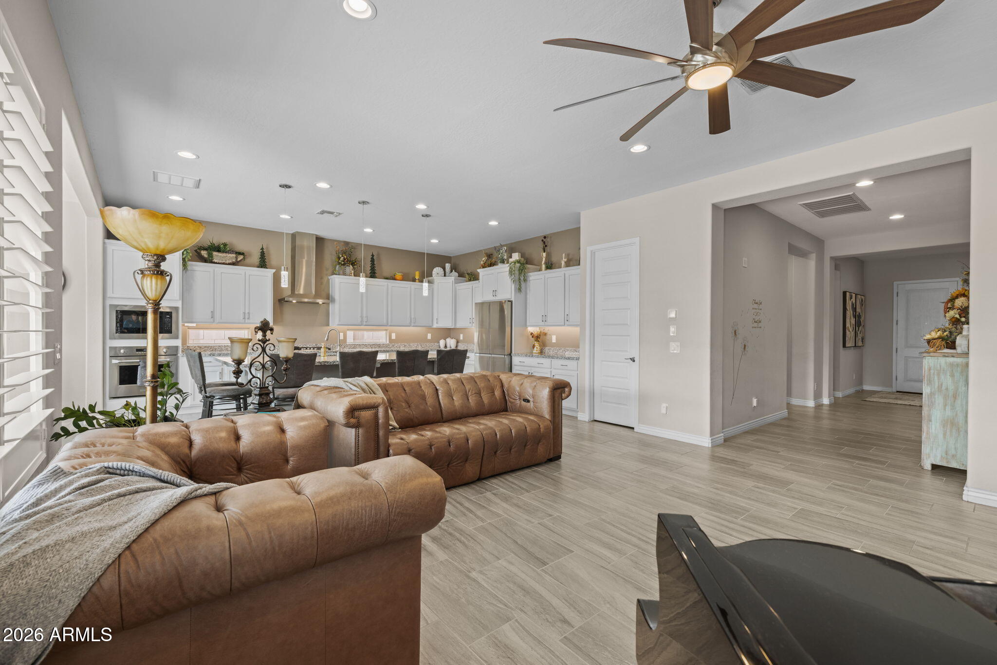 5250 South Wesley Mesa, AZ 85212 - Photo 3 of 89 a living room with furniture and a view of kitchen