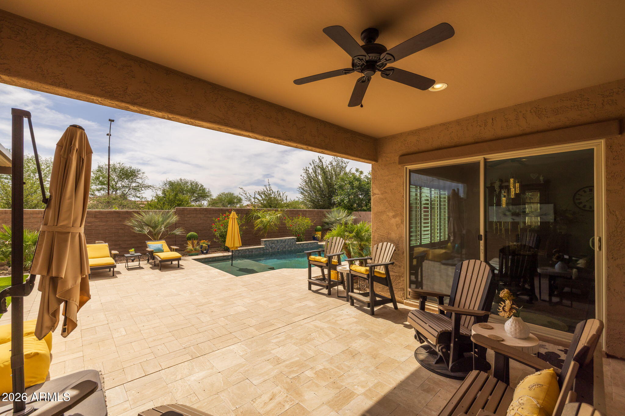 5250 South Wesley Mesa, AZ 85212 - Photo 55 of 89 a view of a patio with a dining table chairs and a chandelier