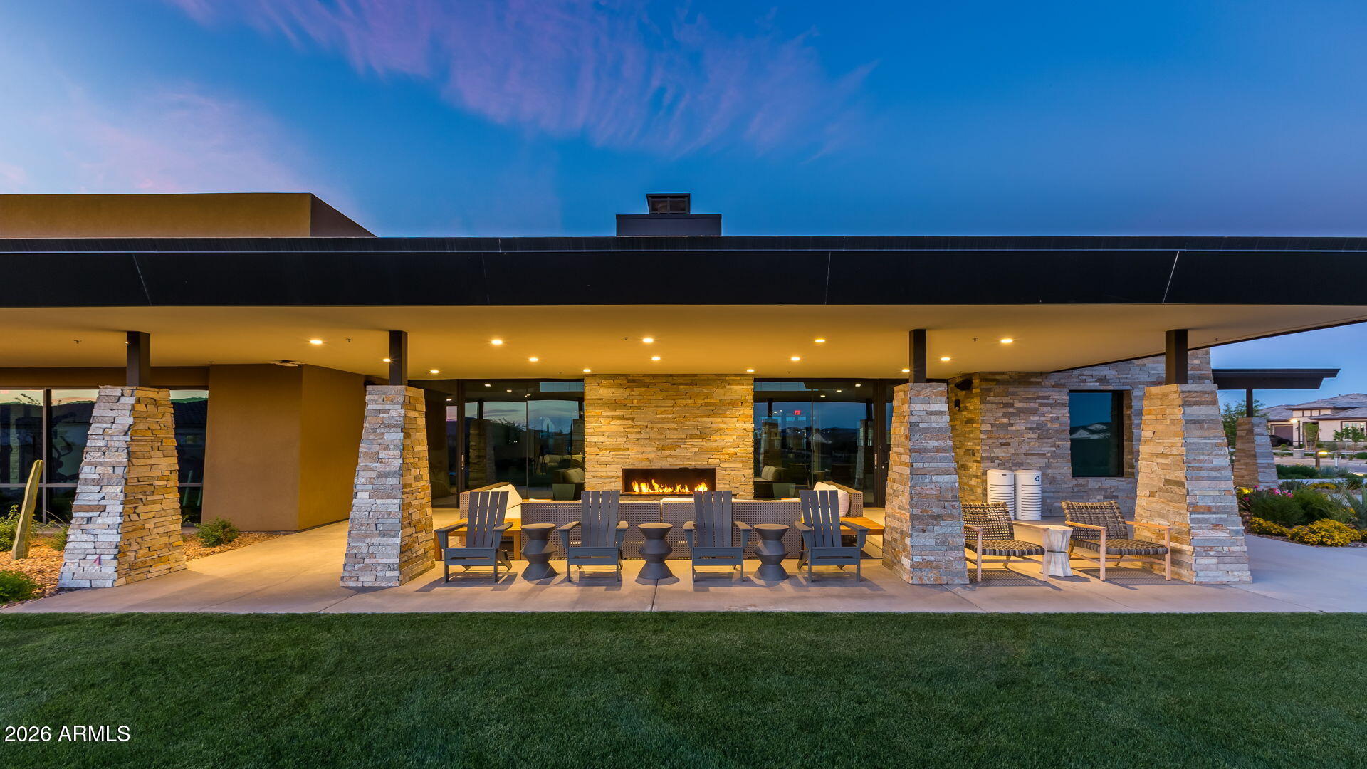 5250 South Wesley Mesa, AZ 85212 - Photo 72 of 89 a view of a patio with table and chairs under an umbrella with a fire pit