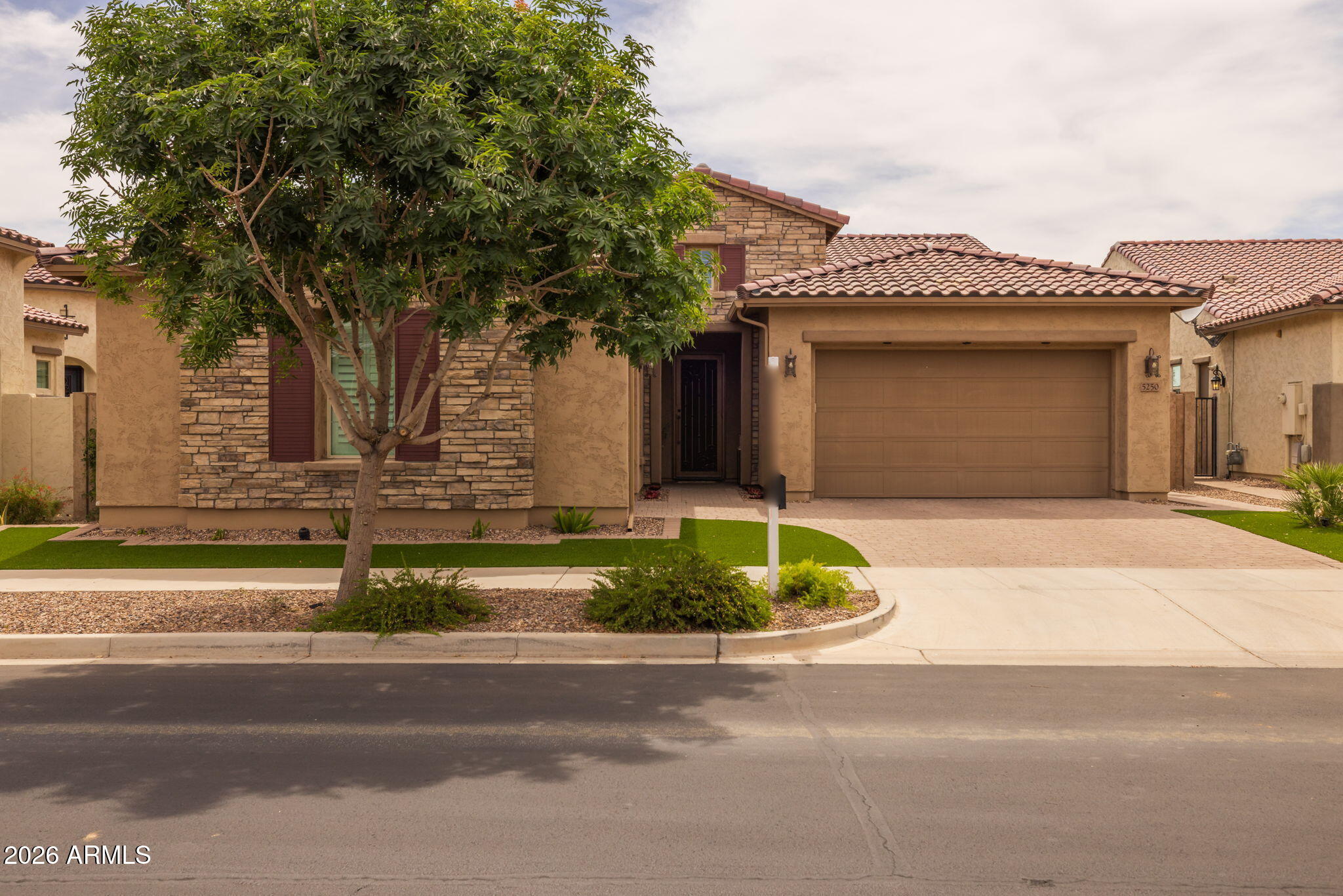 5250 South Wesley Mesa, AZ 85212 - Photo 8 of 89 a front view of a house with a garden