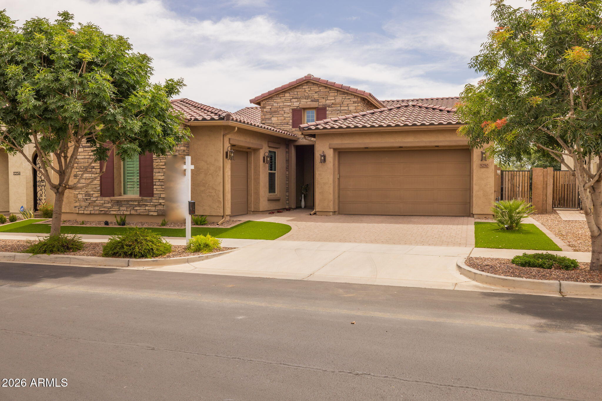 5250 South Wesley Mesa, AZ 85212 - Photo 9 of 89 a front view of a house with a yard and garage