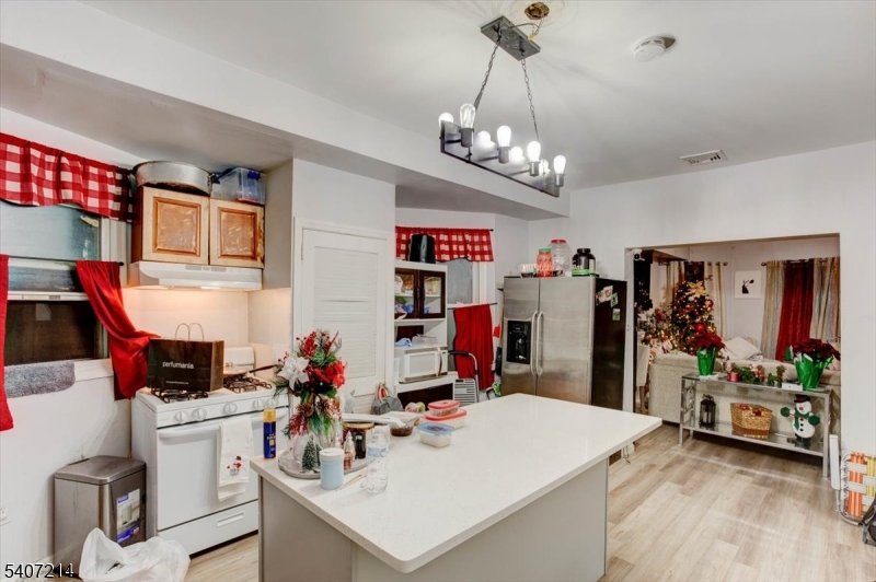 756 South 10th Street Newark, NJ 07108 - Photo 14 of 19 a view of kitchen center island and living room