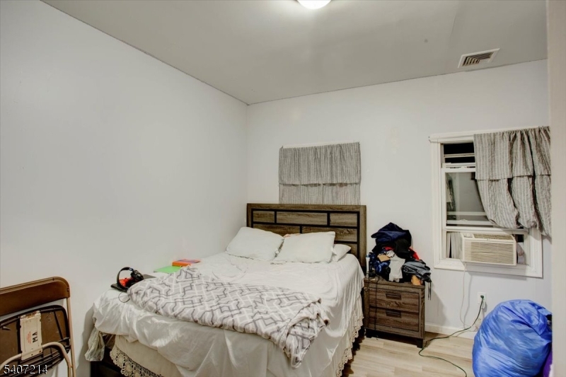 756 South 10th Street Newark, NJ 07108 - Photo 18 of 19 a bedroom with a bed and furniture