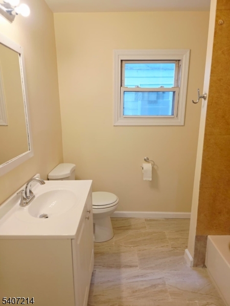 756 South 10th Street Newark, NJ 07108 - Photo 8 of 19 a bathroom with a sink mirror and toilet